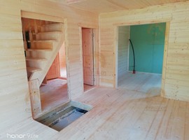 КД35. Полутораэтажный каркасный дом 8х8 с террасой и эркером. Фото