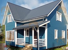 КД35. Полутораэтажный каркасный дом 8х8 с террасой и эркером. Фото