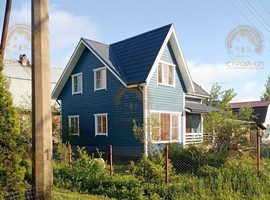 КД35. Полутораэтажный каркасный дом 8х8 с террасой и эркером. Фото